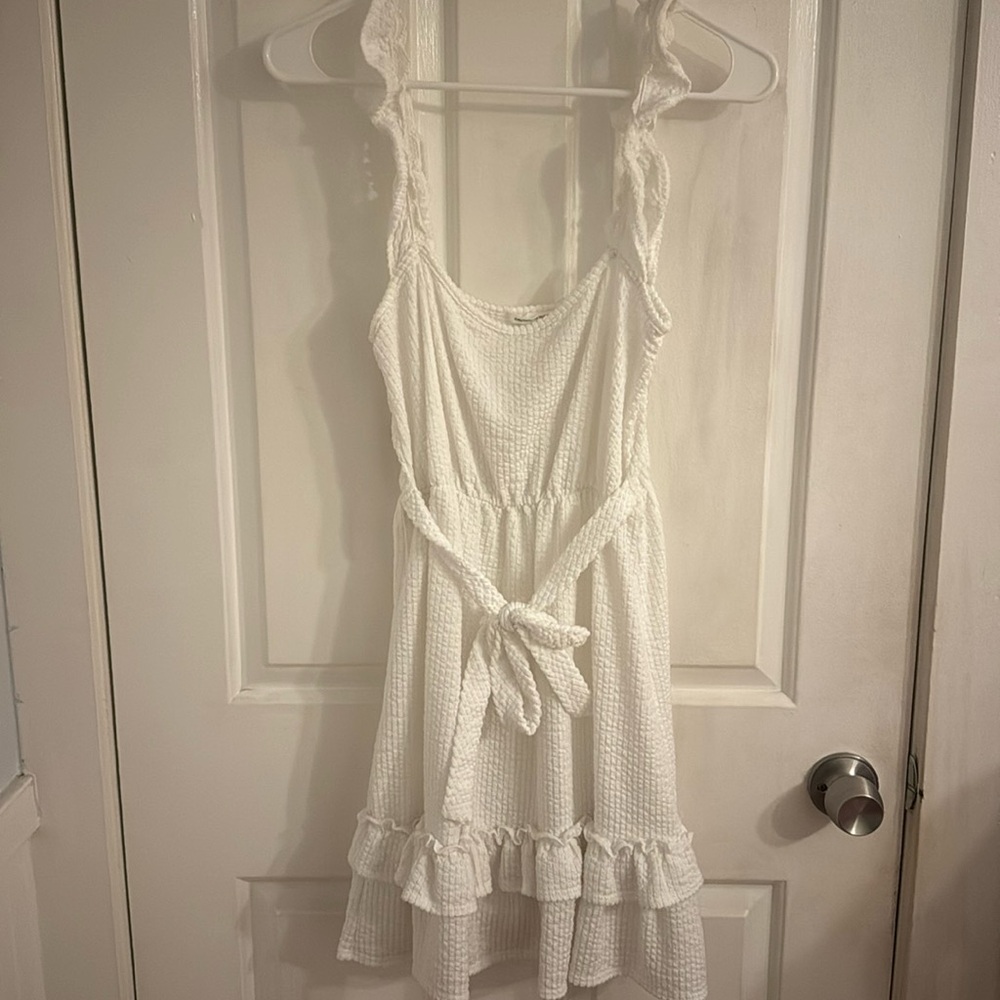This is a white flowy dress for the summer time. It’s super lightweight and cute